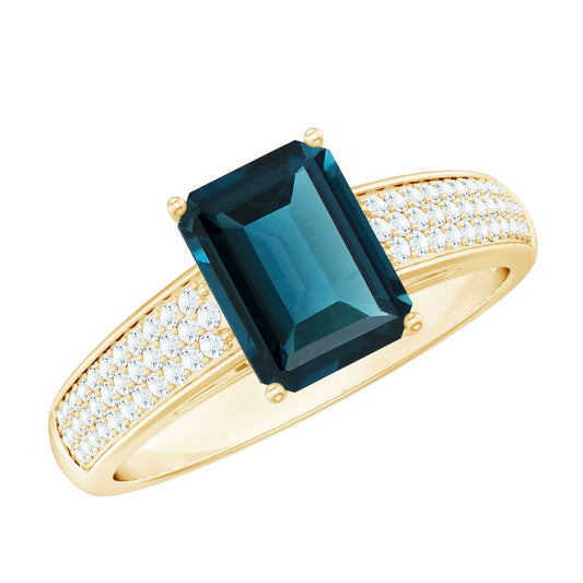 Anillo de compromiso con topacio azul de Londres talla esmeralda de 2,2 quilates y diamantes laterales
