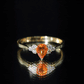 0.6 Carat Pear Shaped Fire Opal Engagement Ring with Diamond Trio
