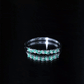Anillo de media eternidad de esmeraldas y diamantes marquesa