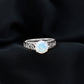 Ethiopian Opal Celtic Knot Engagement Ring with Surprise Diamond