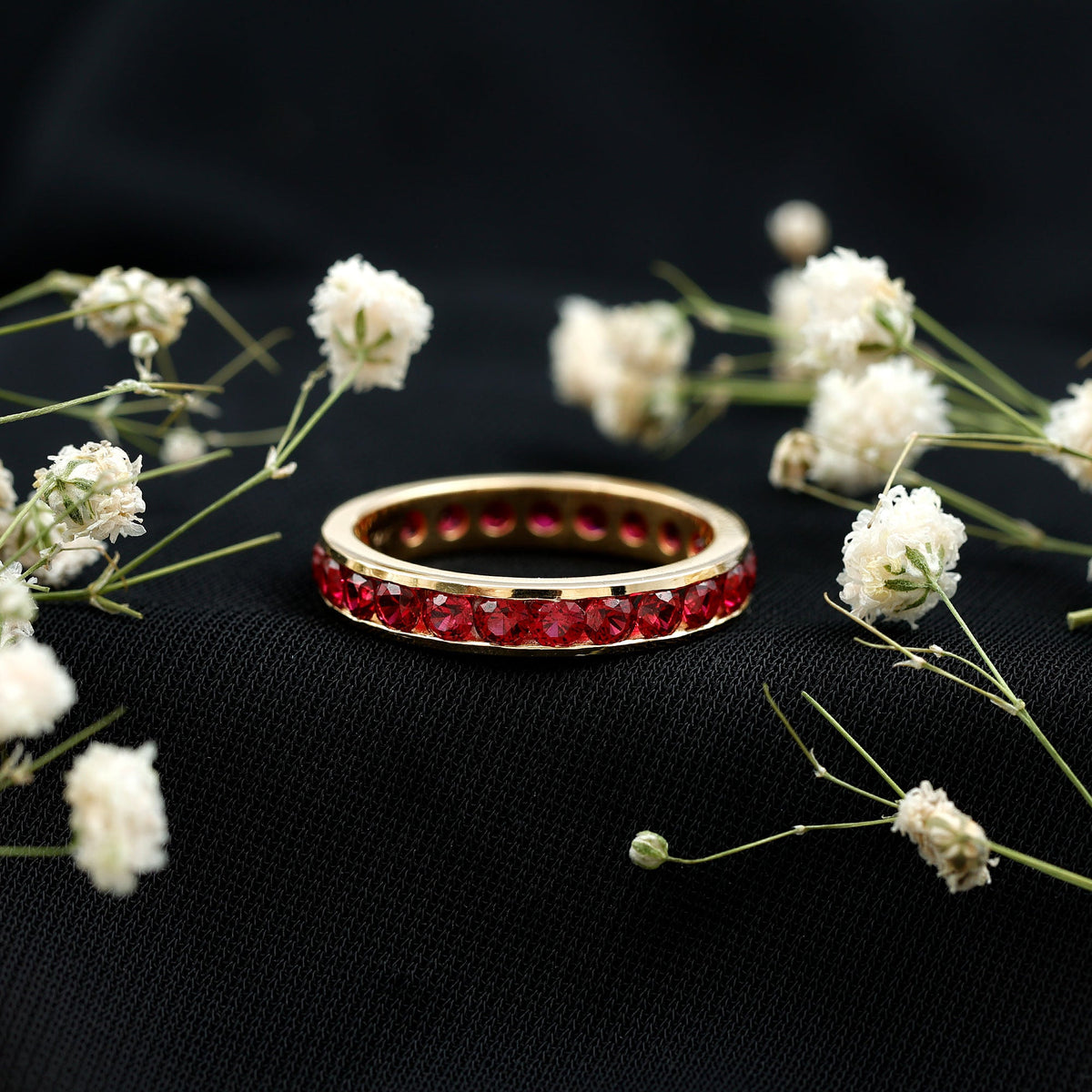 Round Created Ruby Full Eternity Ring in Channel Setting
