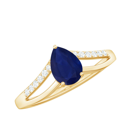 Anillo solitario de zafiro azul corte pera con diamantes y brazo dividido