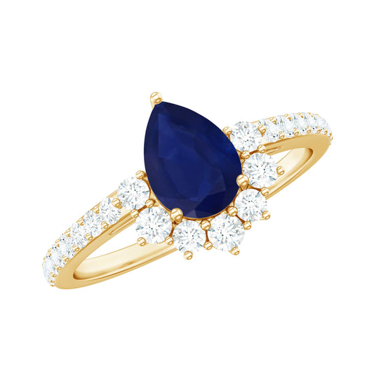 Anillo de compromiso de medio halo con zafiro azul en forma de pera de 0,5 quilates y diamantes