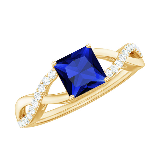 Anillo de compromiso con zafiro azul de laboratorio de 1,5 quilates talla princesa y vástago cruzado de diamantes