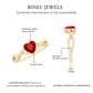 Lab Created Ruby and Diamond Heart Engagement Ring in Crossover Band