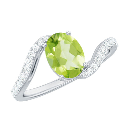 Anillo de compromiso de peridoto ovalado natural de 1 quilate con vástago de diamante tipo bypass