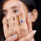 Anillo de compromiso de tanzanita en forma de pera auténtica con halo de diamantes