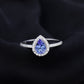 Anillo de compromiso de tanzanita en forma de pera auténtica con halo de diamantes