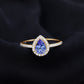 Anillo de compromiso de tanzanita en forma de pera auténtica con halo de diamantes