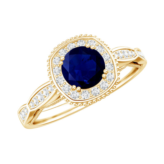 Anillo de compromiso antiguo con zafiro azul de 0,9 quilates y halo de diamantes