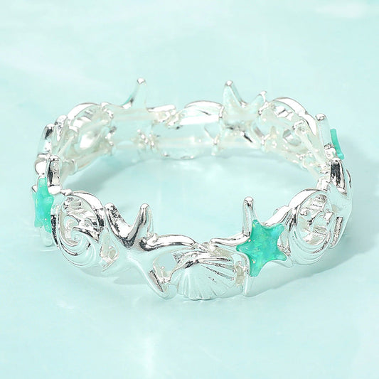 Pulsera elástica con eslabones de estrellas de mar, conchas y olas
