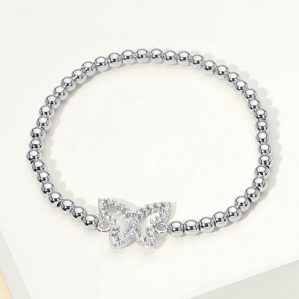 Brazalete elástico de acero inoxidable con dije de mariposa de circonita cúbica pavimentada y cuentas