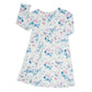 Vestido de niña con mariposa y remolinos en acuarela